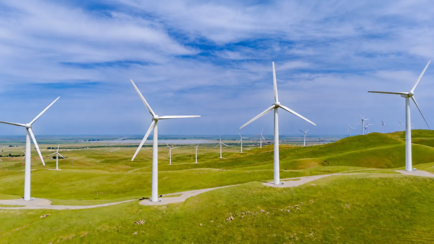 Wind turbines on green hills
